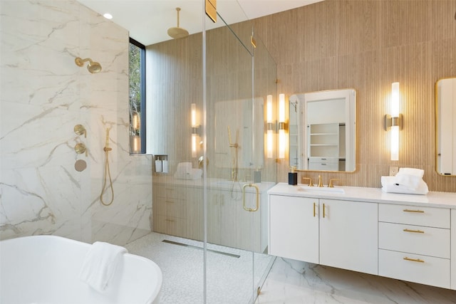 bathroom featuring vanity, tile walls, and independent shower and bath