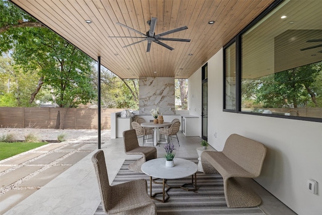 view of patio featuring ceiling fan