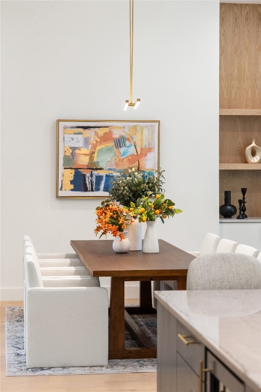 dining space with light wood-type flooring