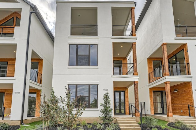 9103 Cattle Baron Path, Austin, TX 78747 - view of front of house with stucco siding and a balcony
