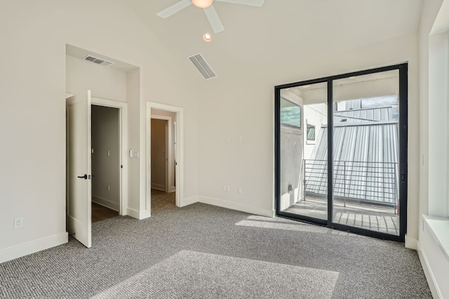 spare room featuring high vaulted ceiling, carpet floors, and ceiling fan