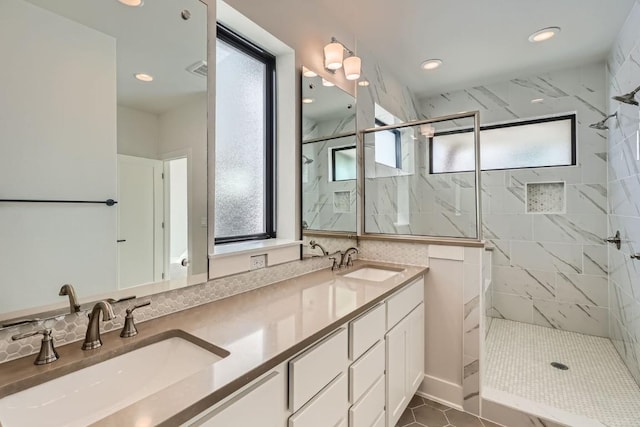 9103 Cattle Baron Path, Austin, TX 78747 - bathroom with a marble finish shower, double vanity, and recessed lighting
