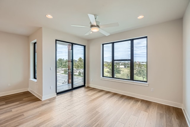 unfurnished room with light wood-type flooring, ceiling fan, and plenty of natural light