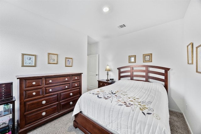 bedroom featuring light colored carpet