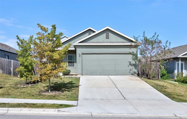 view of front of property featuring a garage and a front yard