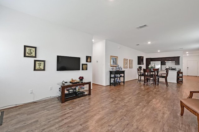 living room featuring wood finished floors and recessed lighting