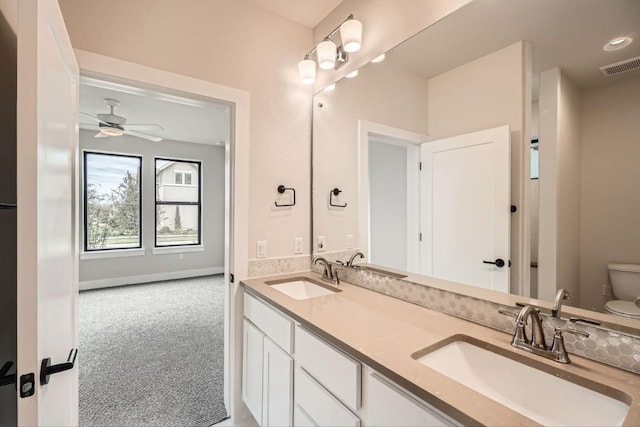 9031 Cattle Baron Path, Austin, TX 78747 - full bathroom featuring toilet, a ceiling fan, and double vanity