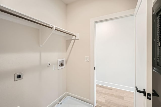 9031 Cattle Baron Path, Austin, TX 78747 - washroom featuring hookup for a washing machine, gas dryer hookup, electric dryer hookup, light wood-style flooring, and baseboards