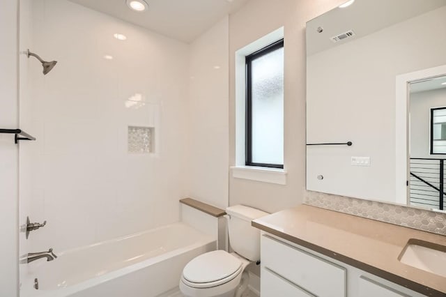 9031 Cattle Baron Path, Austin, TX 78747 - bathroom featuring vanity, toilet, bathing tub / shower combination, and recessed lighting