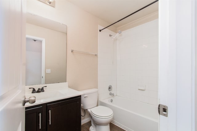 full bathroom with vanity, toilet, wood-type flooring, and tiled shower / bath