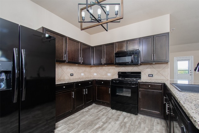 kitchen featuring black appliances, sink, light hardwood / wood-style flooring, tasteful backsplash, and dark brown cabinetry