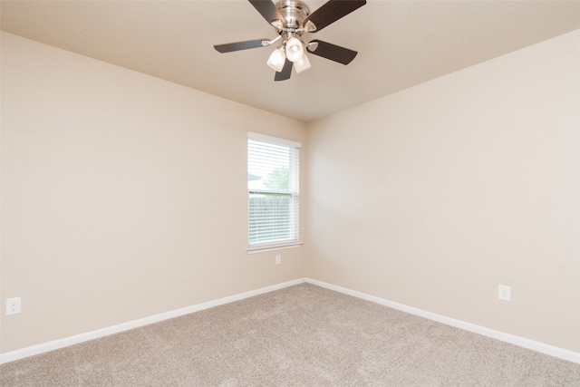 empty room with carpet and ceiling fan