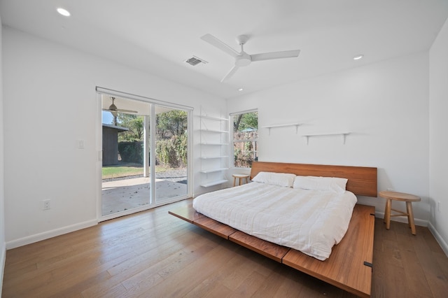 bedroom with ceiling fan, access to exterior, and wood-type flooring