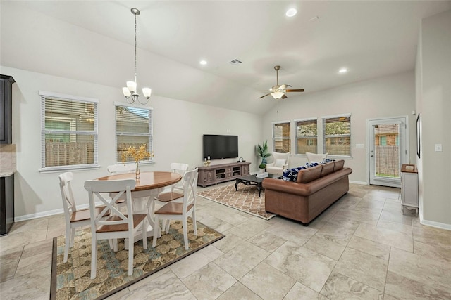 living room with ceiling fan with notable chandelier and vaulted ceiling