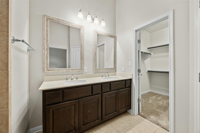 bathroom featuring tile patterned flooring and vanity