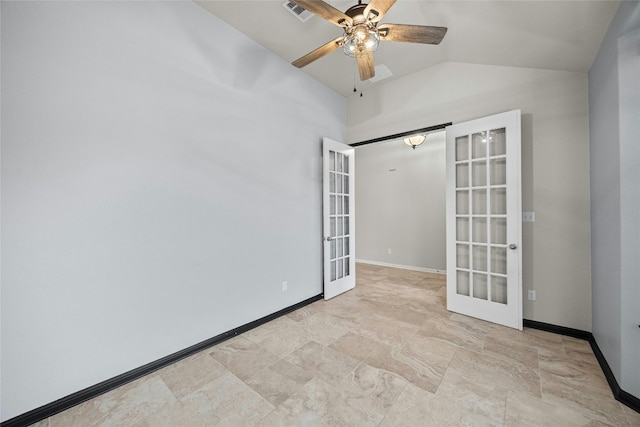 empty room featuring french doors, lofted ceiling, and ceiling fan