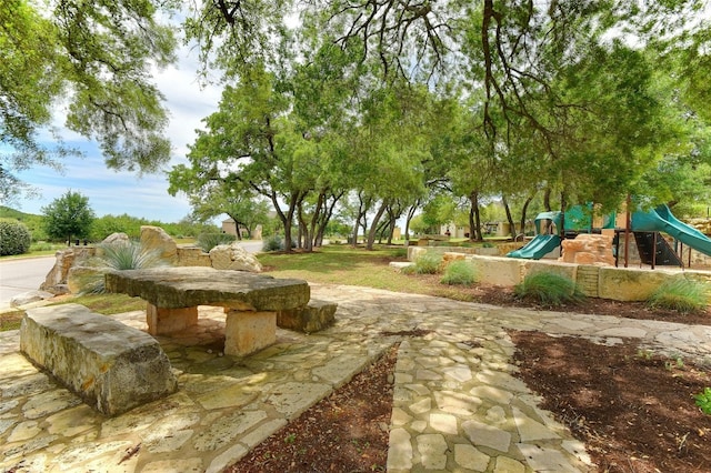 view of home's community with a playground