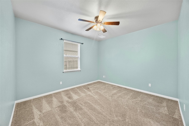 carpeted empty room with ceiling fan