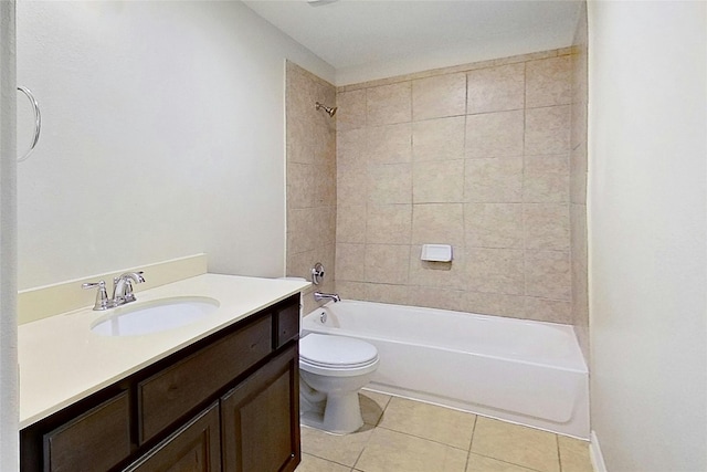 full bathroom with tile patterned flooring, vanity, toilet, and tiled shower / bath combo