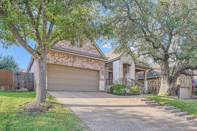 view of front of property with a front lawn and a garage