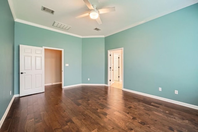 empty room featuring ceiling fan, dark hardwood / wood-style flooring, and crown molding