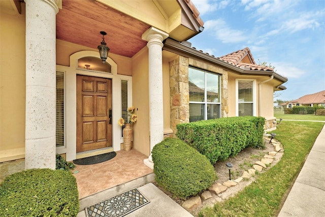 doorway to property with a porch