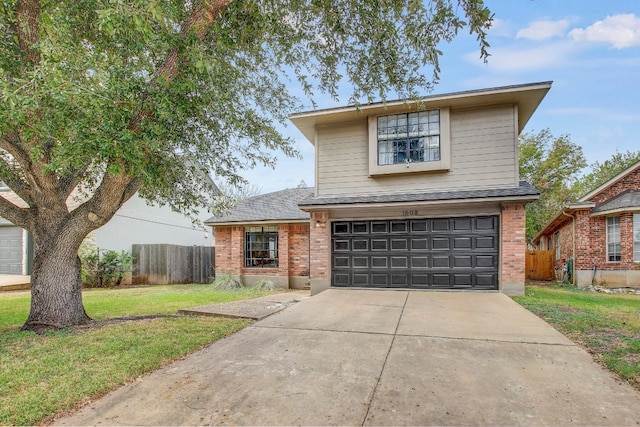 view of front property with a garage and a front yard