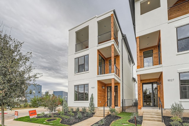 contemporary home with a balcony