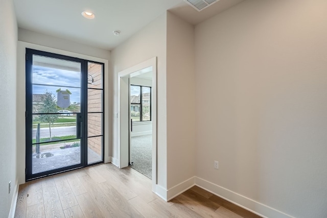 entrance foyer with light hardwood / wood-style floors