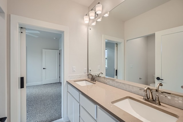 bathroom with vanity and toilet