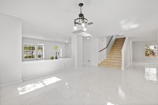 unfurnished living room with plenty of natural light