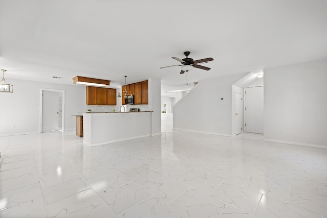 unfurnished living room with ceiling fan