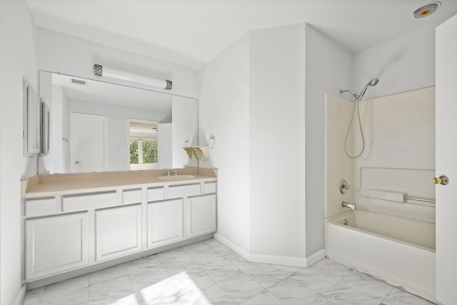 bathroom featuring vanity and shower / tub combination