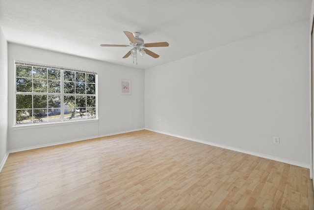 unfurnished room featuring ceiling fan and light wood-type flooring