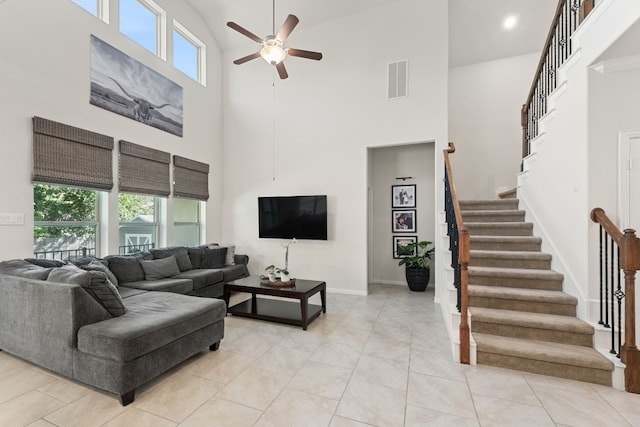 living room featuring light tile patterned flooring, ceiling fan, plenty of natural light, and high vaulted ceiling