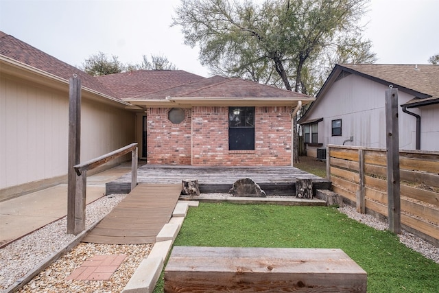 back of house with a lawn and a patio area