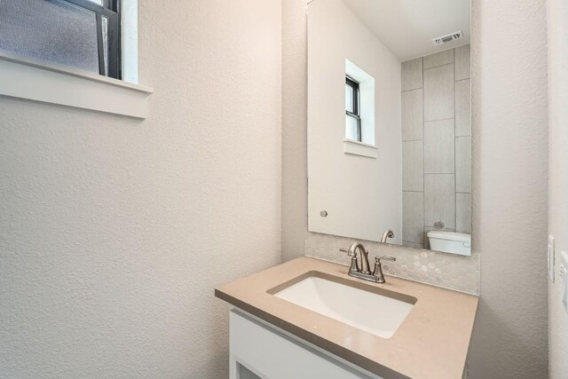 9027 Cattle Baron Path, Austin, TX 78747 - bathroom with vanity and a textured wall