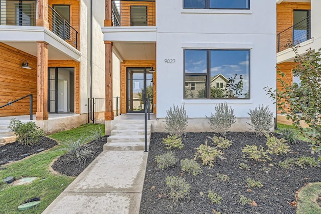 9027 Cattle Baron Path, Austin, TX 78747 - doorway to property featuring stucco siding