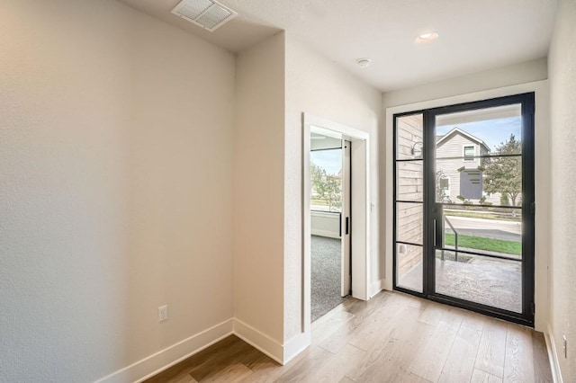 9027 Cattle Baron Path, Austin, TX 78747 - entryway featuring light wood-type flooring and baseboards