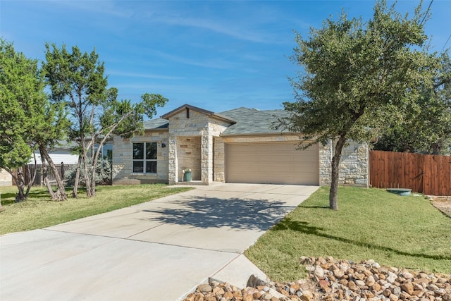 ranch-style home with a garage and a front lawn