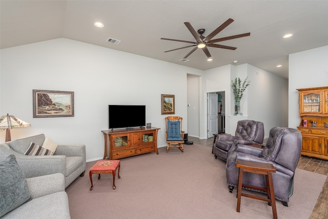 living room with carpet, vaulted ceiling, and ceiling fan