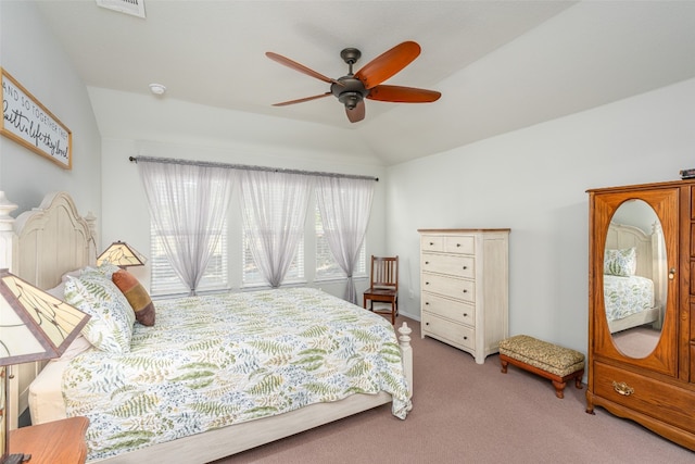 carpeted bedroom with ceiling fan and lofted ceiling