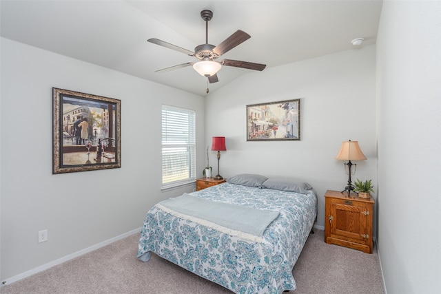 bedroom featuring ceiling fan, light carpet, and vaulted ceiling