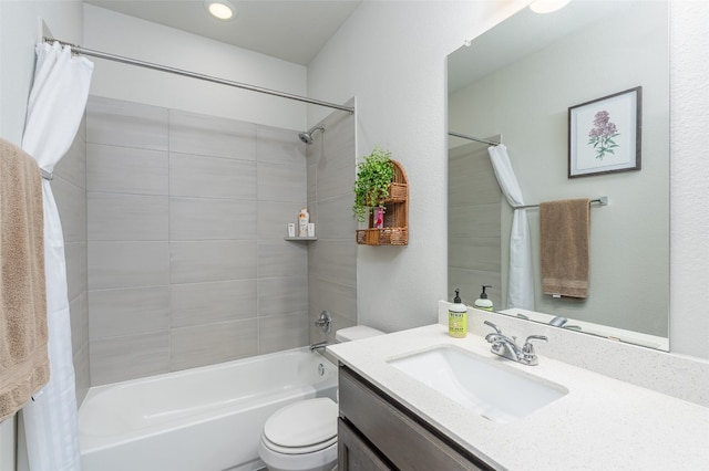 full bathroom with vanity, shower / bath combination with curtain, and toilet