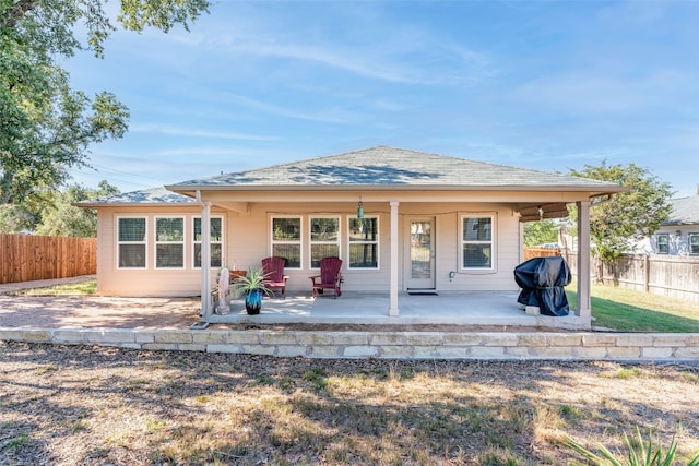 back of property with a patio area