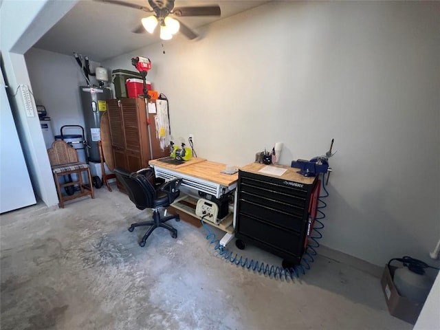 4303 Lindberg Ln, Lago Vista, TX 78645 - home office featuring electric water heater, concrete flooring, and ceiling fan
