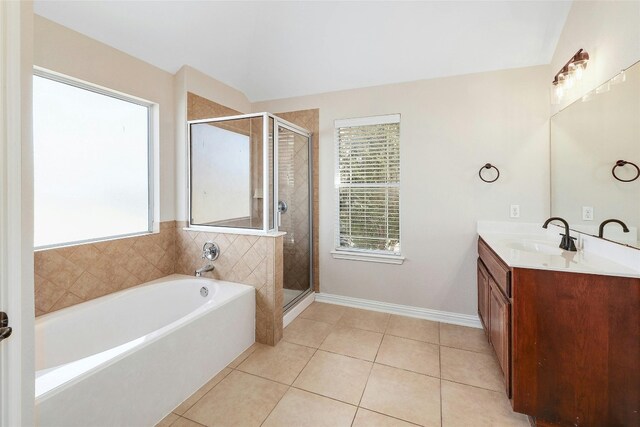 bathroom with vanity, independent shower and bath, and tile patterned flooring