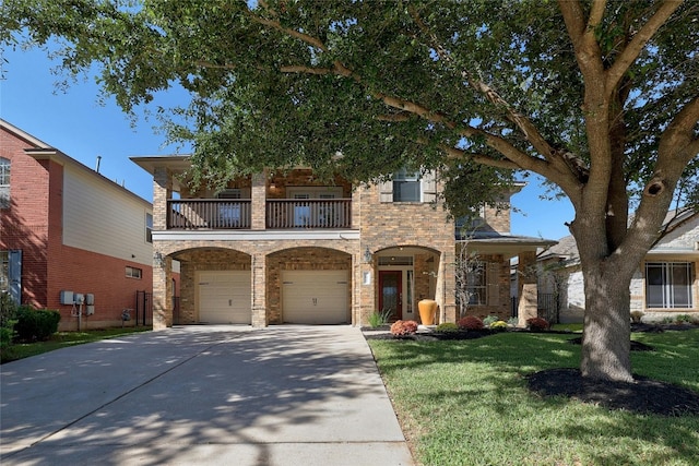 view of front of house with a balcony, a garage, and a front lawn