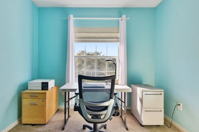 office area featuring light colored carpet