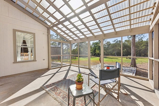 sunroom featuring lofted ceiling